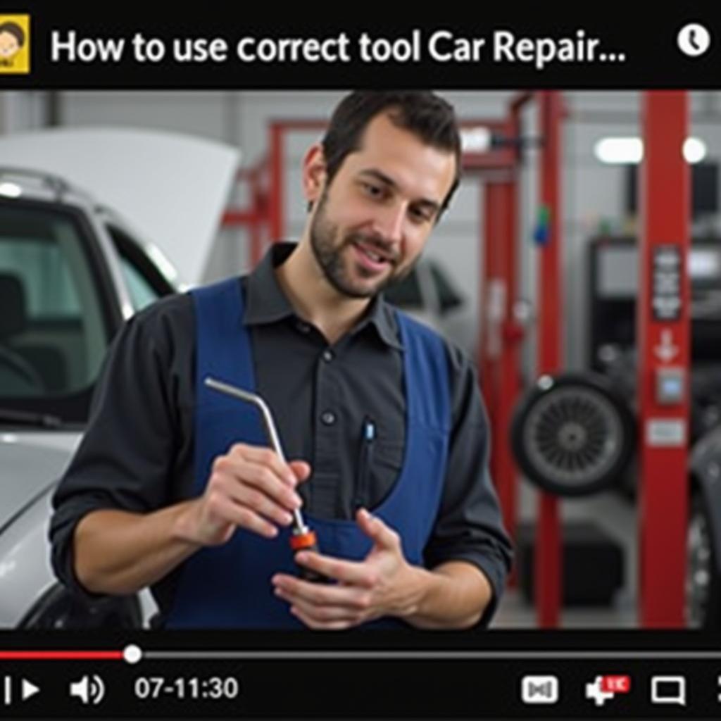 Auto Motor Sport YouTube Qualität: Ein Mechaniker zeigt die richtigen Werkzeuge für eine Autoreparatur in einem YouTube-Video.